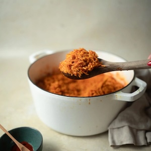 jollof rice with a spoonful in the foreground